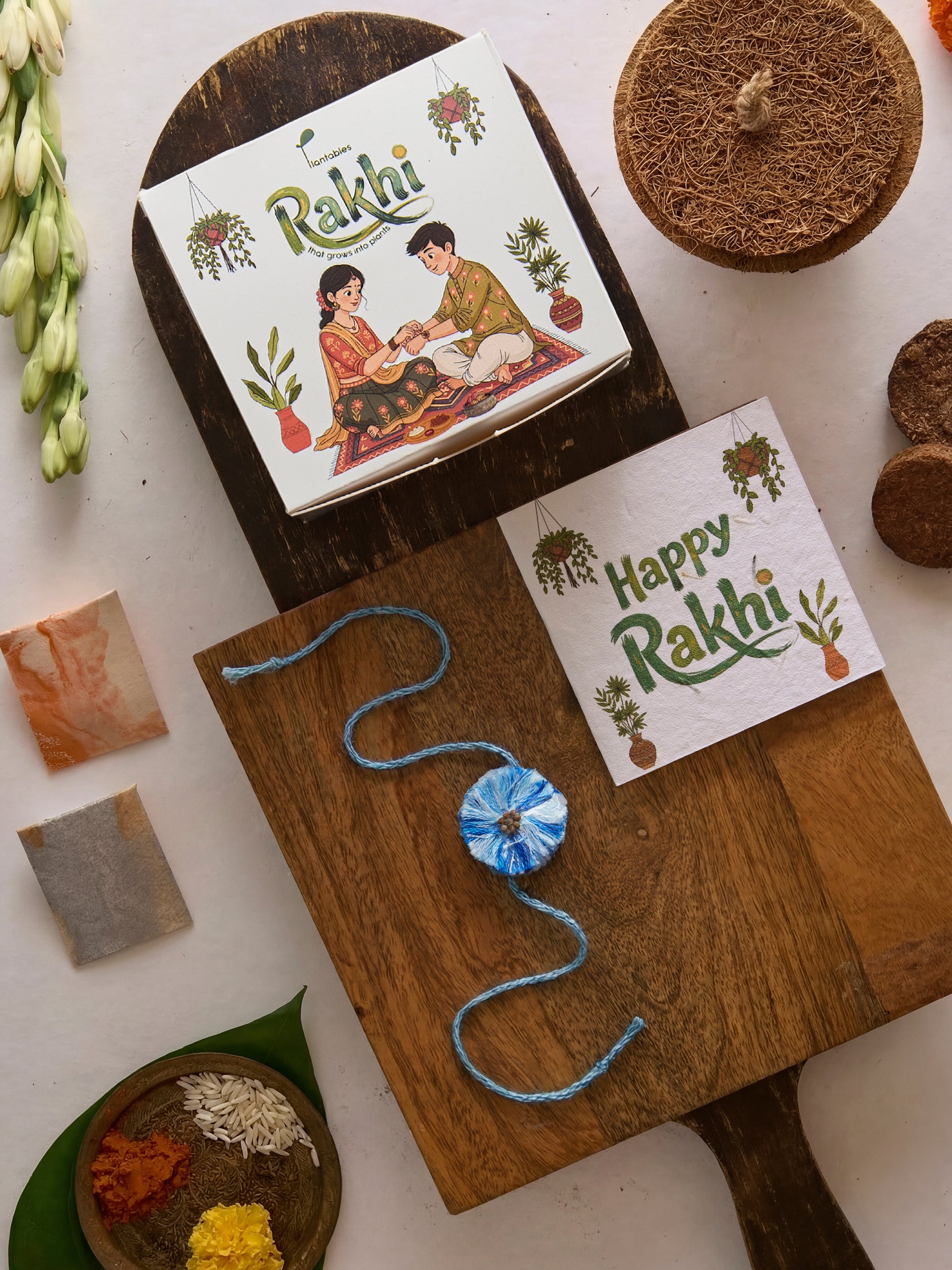 Evil Eye Thread Rakhi Planting Kit with seed paper greeting card, roli chawal pockets and coir pot